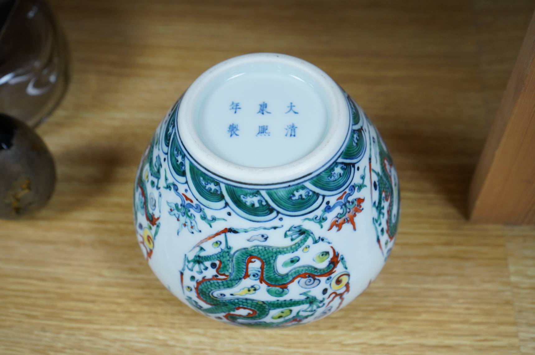 A Chinese doucai 'dragon' roundel vase, Kangxi mark but later, 13cm